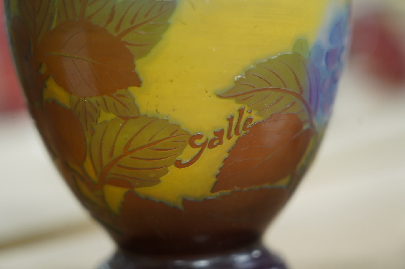 A Gallé blue globular vase with yellow ground, 15cm high. Condition - fair to good, some surface scratches and scratches to base